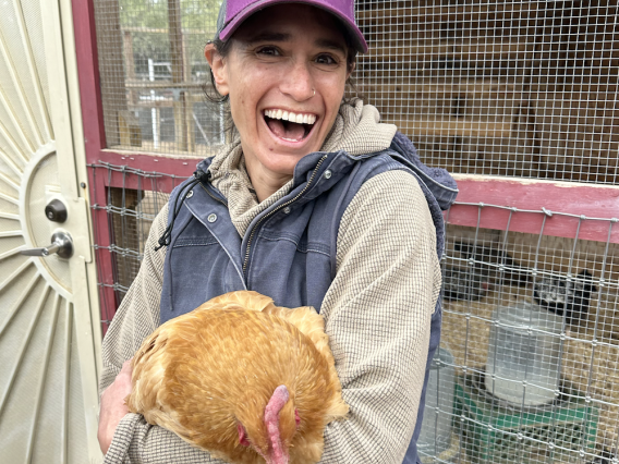 Girl smiling with chicken